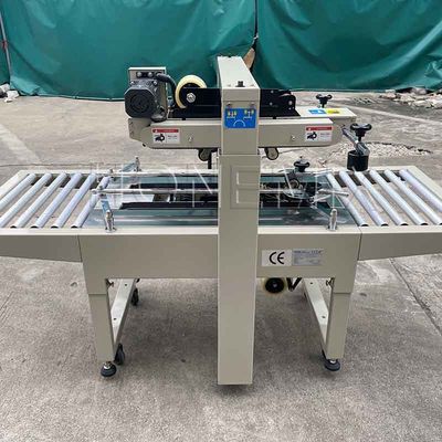220V / 50HZ Automatische Verpackungsmaschine 12mm Kartonbox Versiegelung Klebeband
